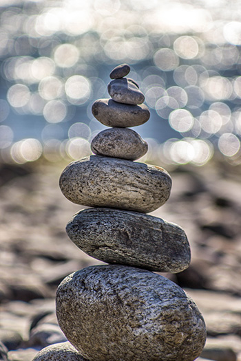 yoga for bedridden patients is symbolized in a stack of stones